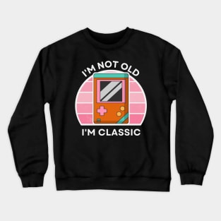 I'm not old, I'm Classic | Handheld Console | Retro Hardware | Vintage Sunset | Gamer girl | '80s '90s Video Gaming Crewneck Sweatshirt